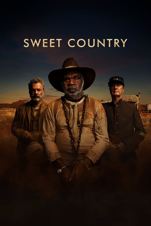 It’s 1929 on the vast, desert-like, Eastern Arrernte Nation lands that are now known as the Central Australian outback. Sam Kelly, a middle-aged Aboriginal man, works the land of a kind preacher, Fred Smith. After an ill-tempered bully arrives in town and Kelly kills him in self-defence, he and his wife go on the run as a posse gathers to hunt him down.